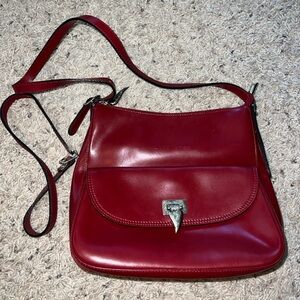 Dark red Lancaster Paris purse, silver detailing, and multiple interior pockets